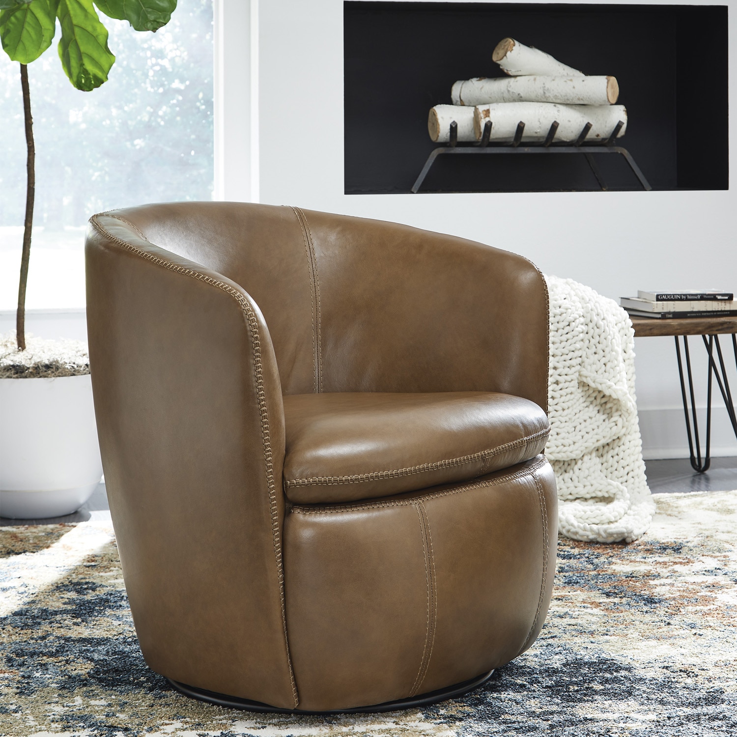 Leather curved swivel chair in room setting