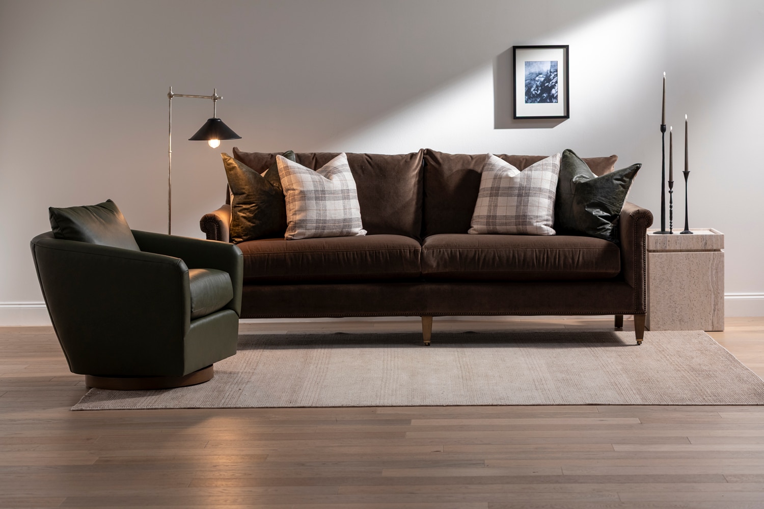 Leather chair with velvet sofa and leather pillows