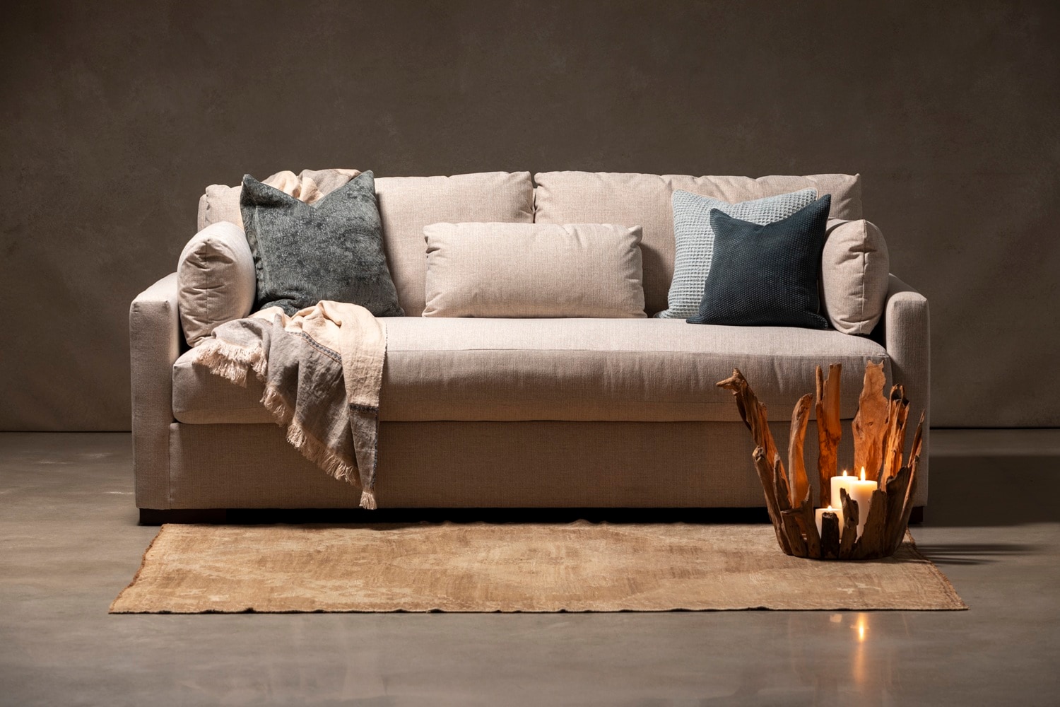 Linen sofa with blue pillows and natural material accents