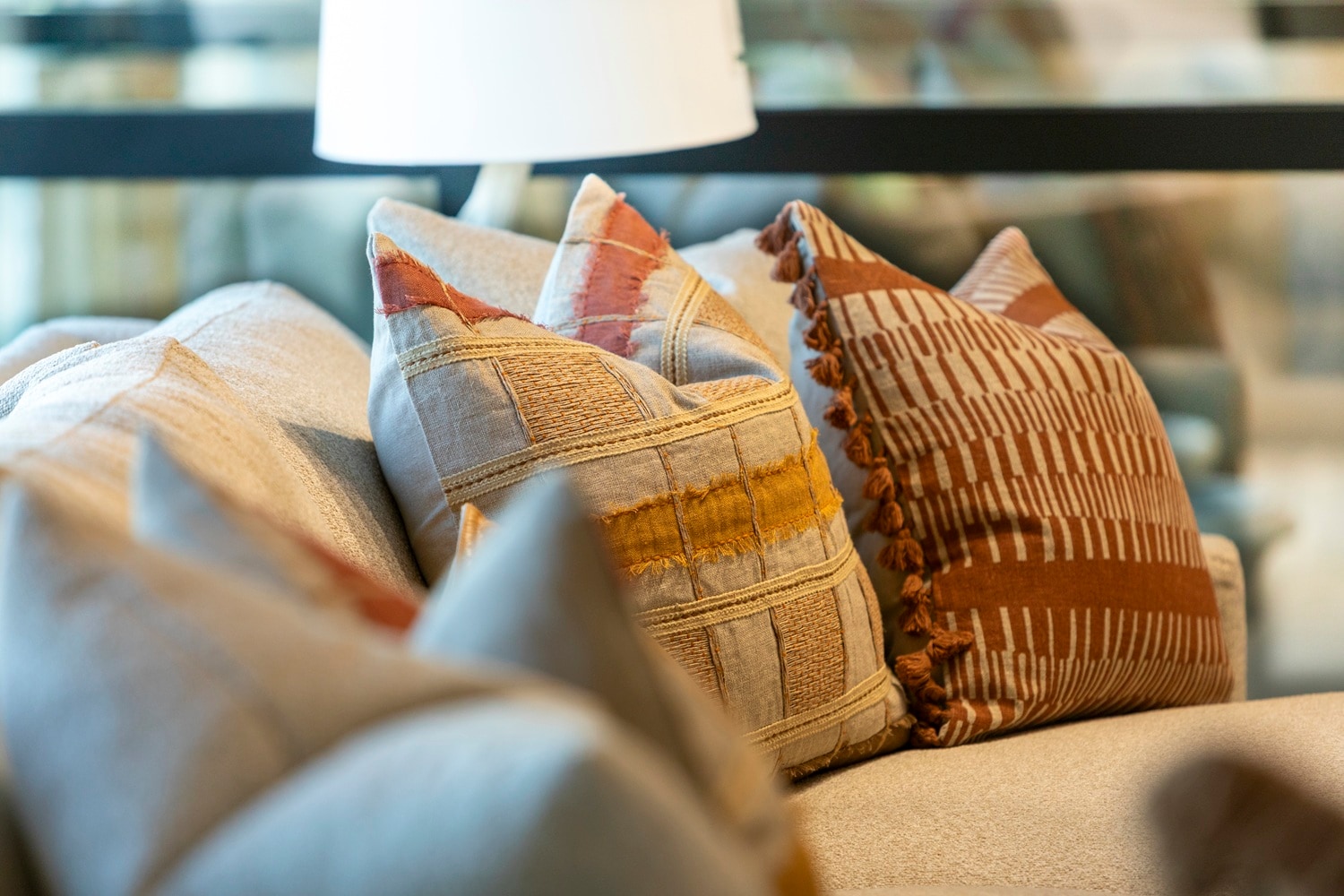 Spring colored throw pillows in orange and rust