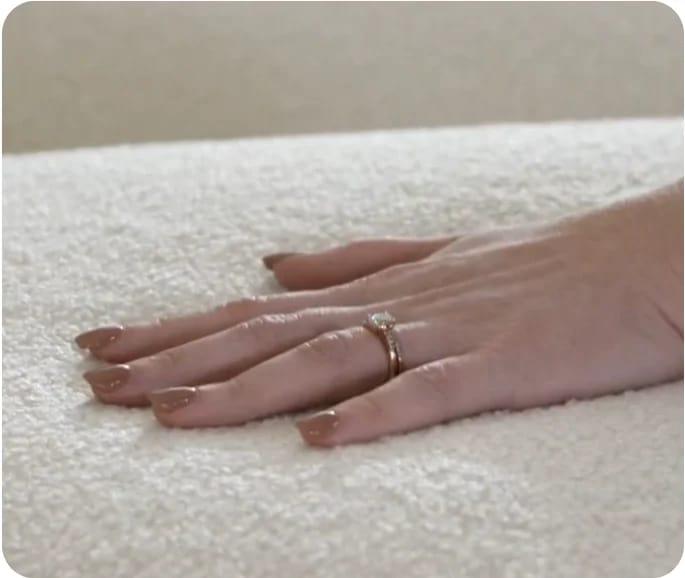 Hand resting on a Flexsteel sofa