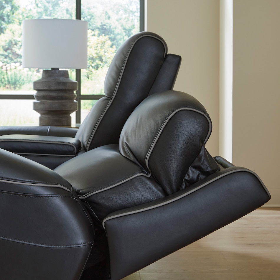 a black leather loveseat   