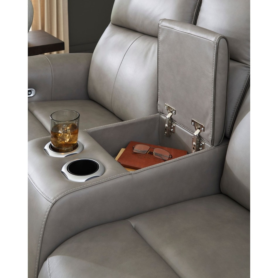 a gray leather loveseat   