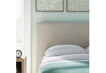 a beige uph headboard   