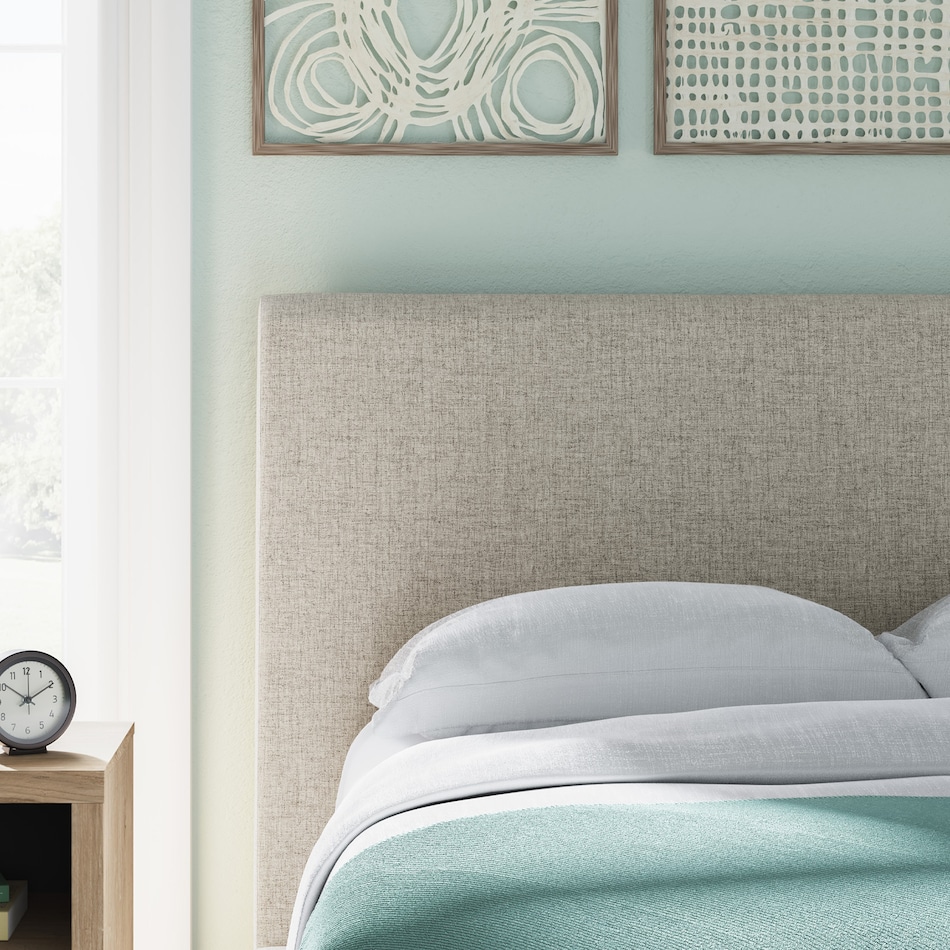 a beige uph headboard   