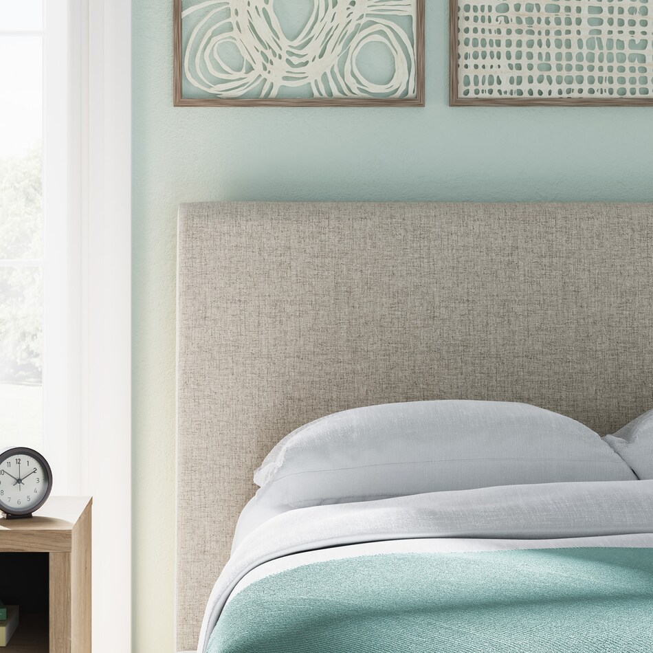 a beige uph headboard   