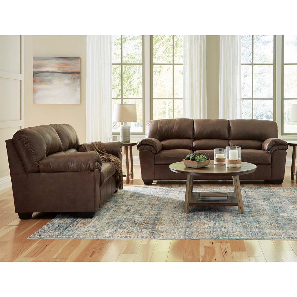 a brown fab loveseat   