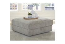 a beige fabric ottoman   
