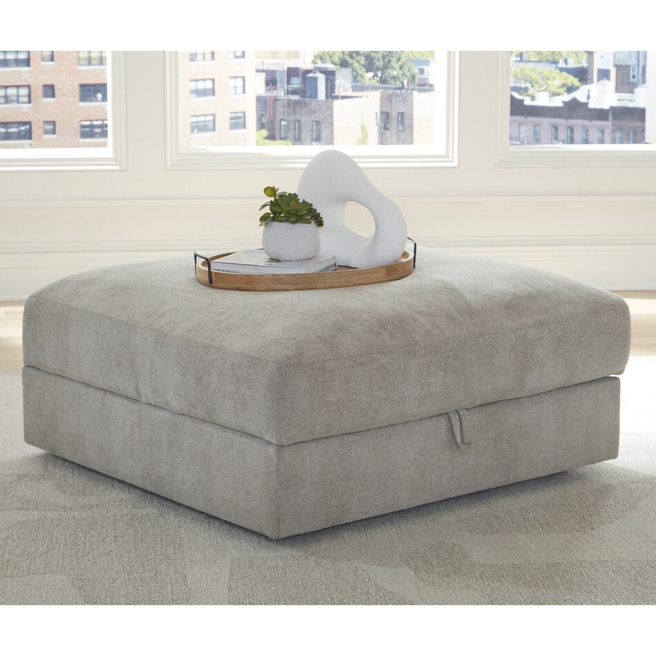 a beige fabric ottoman   
