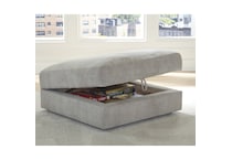 a beige fabric ottoman   