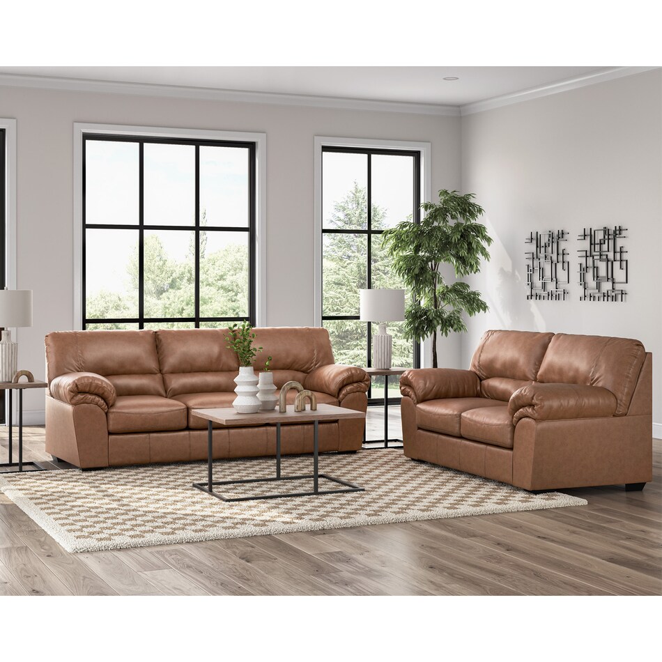 a brown fab loveseat   