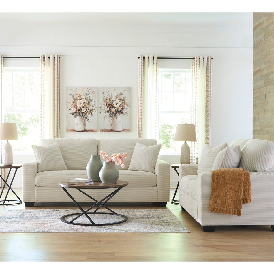 a white fab loveseat   