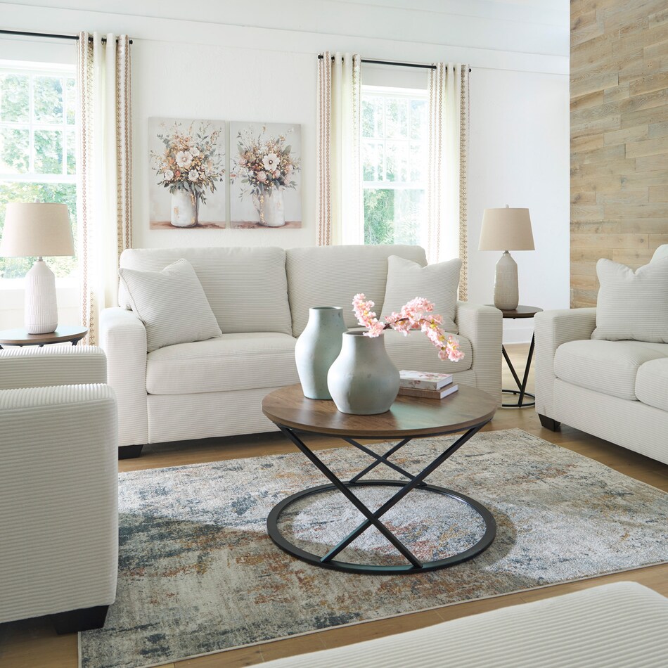 a white fab loveseat   