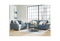 a blue fabric loveseat   