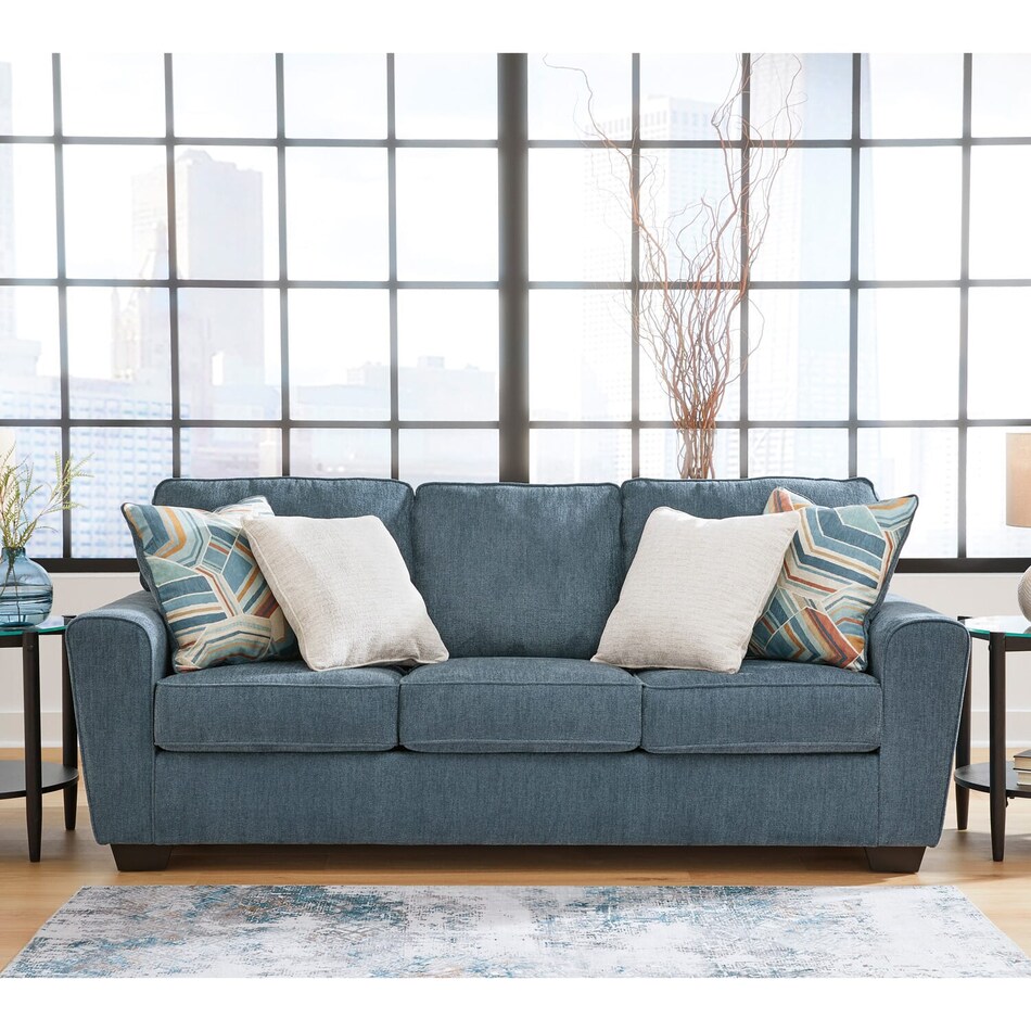 a blue fabric sofa   