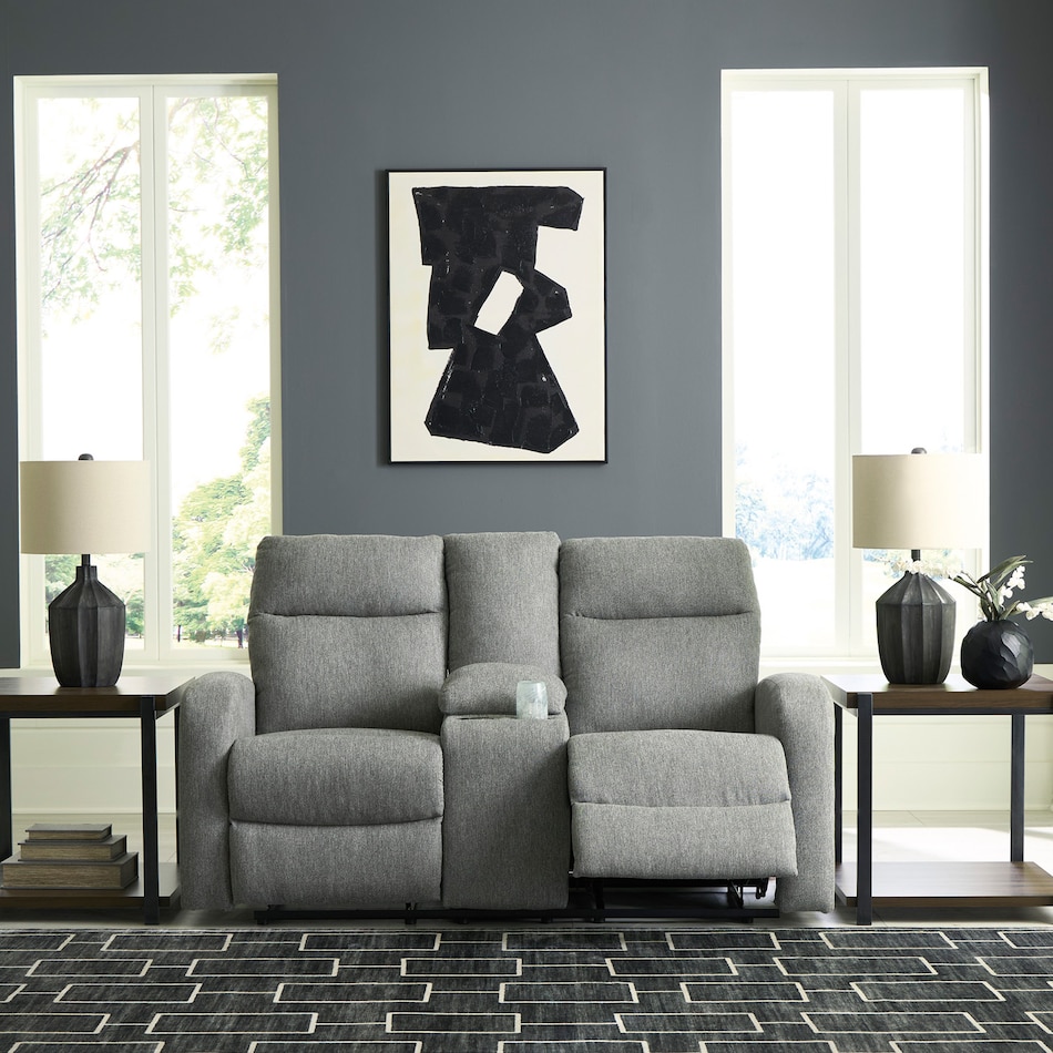 a gray fabric loveseat   