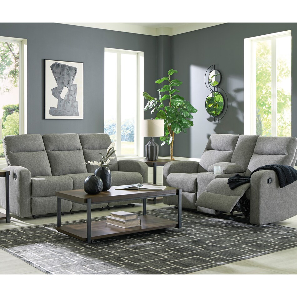 a gray fabric loveseat   