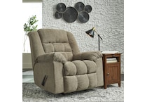 a beige fabric recliner   