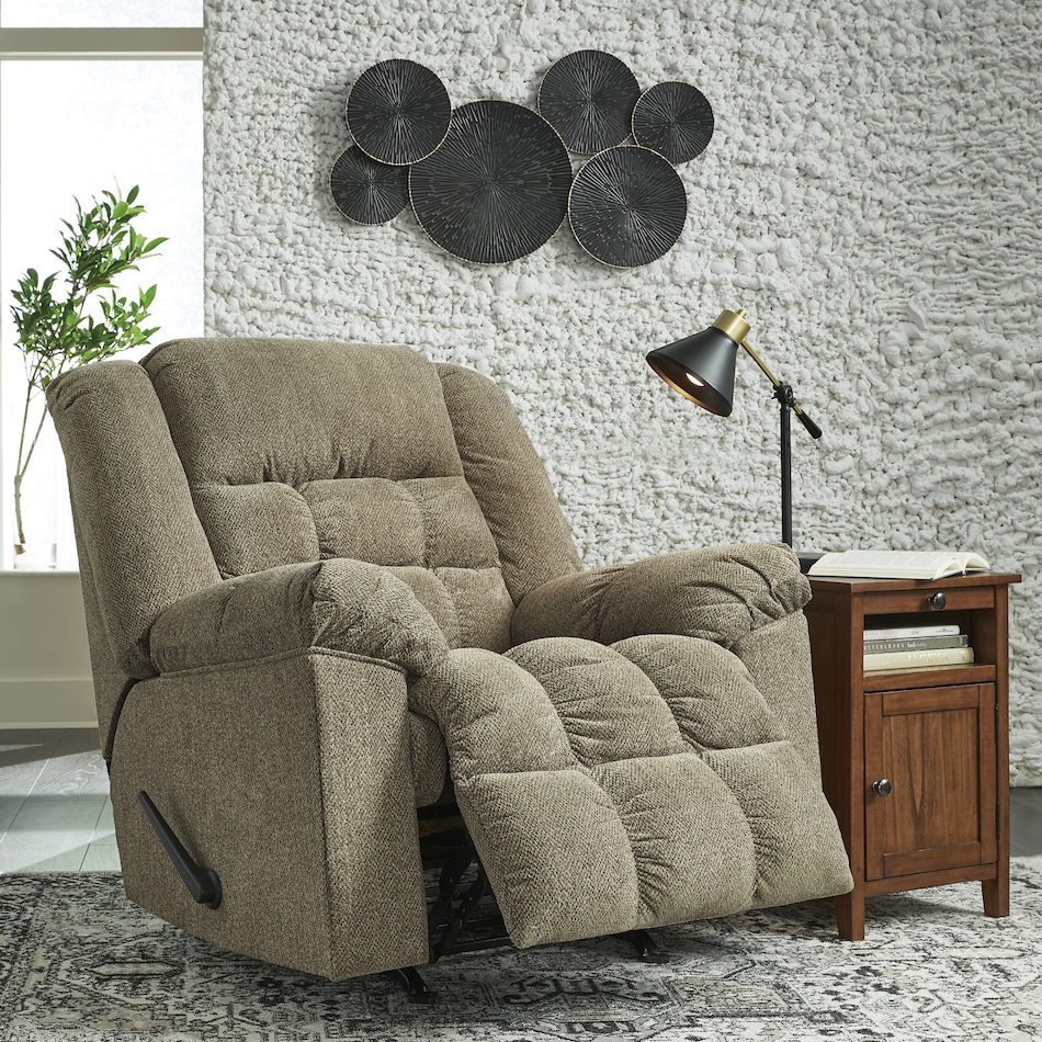 a beige fabric recliner   