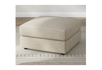 a beige fabric ottoman   