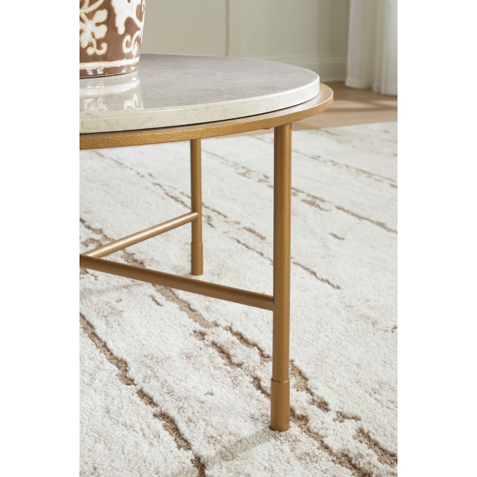 at antiqued goldtone cocktail table   