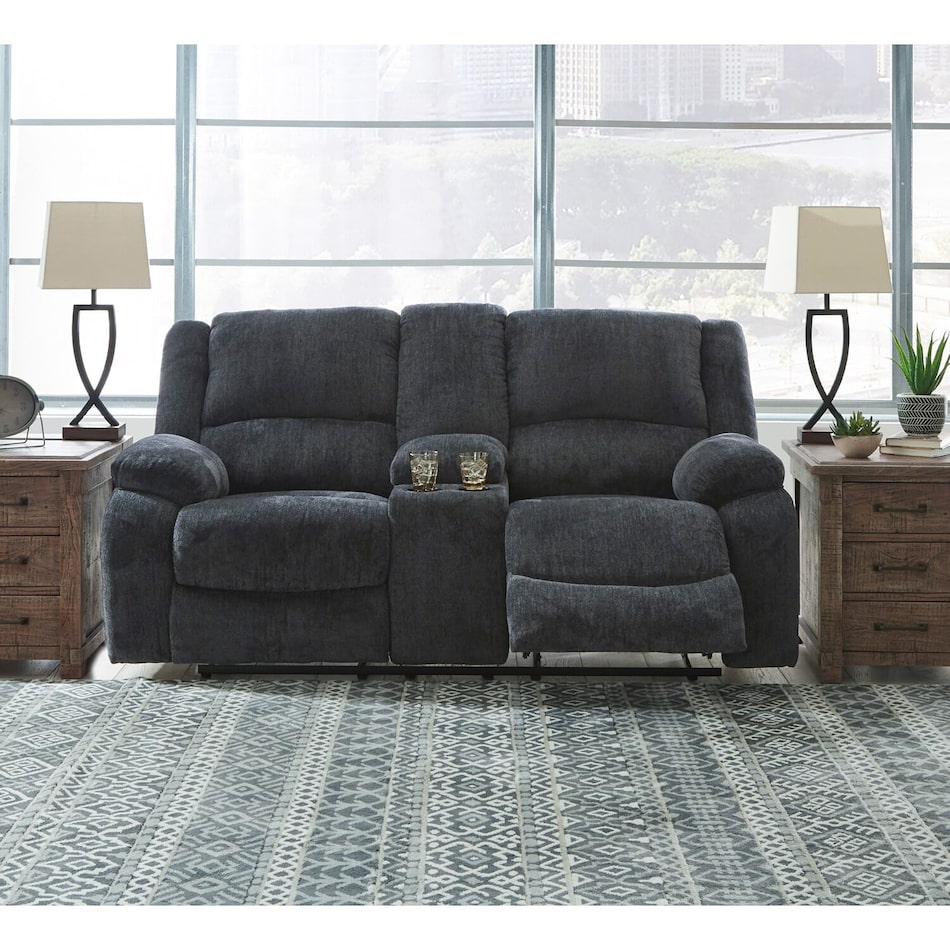 a gray fabric loveseat   