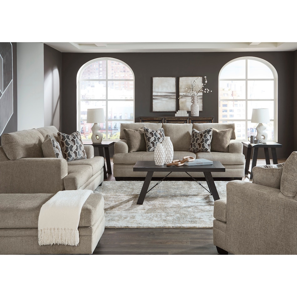 a white fabric loveseat   