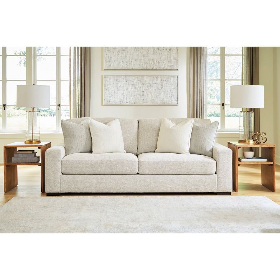 a white fabric sofa   
