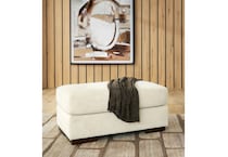 a beige fabric ottoman   