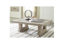 a light brown cocktail table   