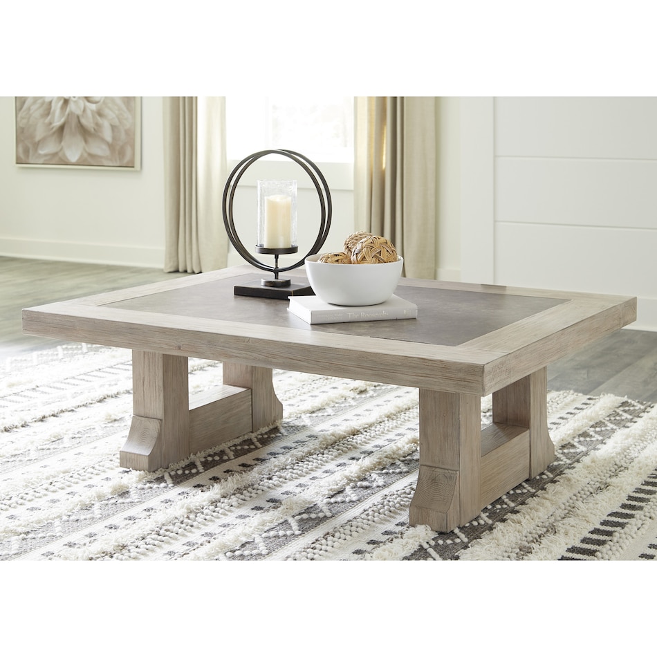 a light brown cocktail table   