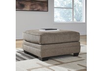 a brown fabric ottoman   