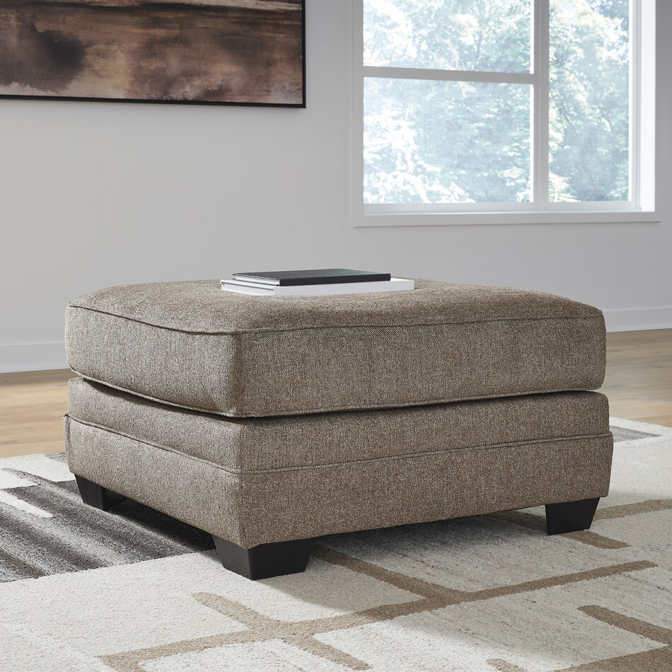 a brown fabric ottoman   