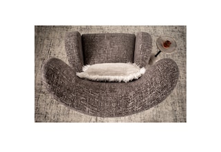 y gray n a chair   