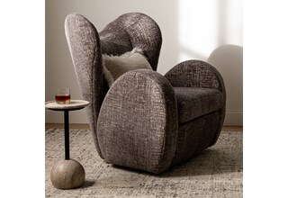 y gray n a chair   
